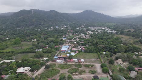 Aerial-view-of-Palomino-village-and-lush-surroundings,-Colombia