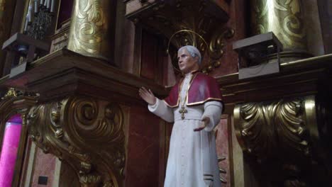 Sculpture-of-a-christian-saint-inside-basilica-of-san-jose-de-flores-latin-landmark-at-buenos-aires-argentina,-monk-wearing-a-rope-in-religious-environment