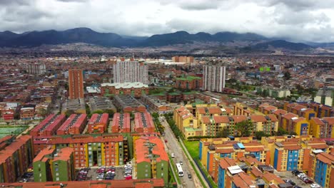 With-the-Central-Cordillera-mountains-as-a-majestic-backdrop,-our-drone-takes-flight,-offering-a-bird's-eye-view-of-Bogotá's-sprawling-landscape