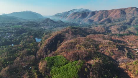 A-magnificent-mountain-range-graces-the-rural-landscape-of-Sangklaburi,-Thailand,-offering-a-picturesque-view-of-nature's-grandeur