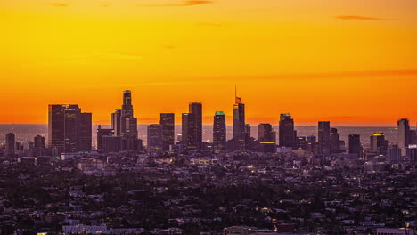 Timelapse-of-the-Downtown-Los-Angeles-skyline-with-a-vivid-sunrise-sky-background