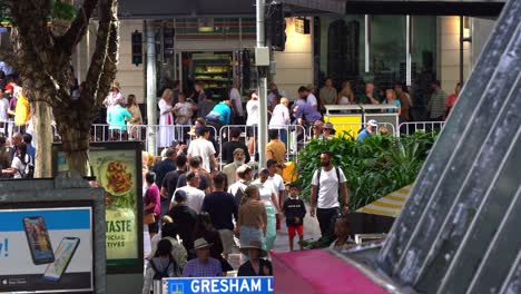 Crowds-of-people-gather-in-downtown-Brisbane-city,-swelling-with-anticipation-before-the-commencement-of-the-annual-tradition-Anzac-Day-parade-at-Anzac-Square