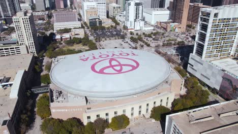 Houston-TX-USA,-Aerial-View-of-Toyota-Center-Arena-in-City-Downtown,-Drone-Shot