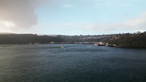 Forward-Linear-Aerial-of-Boats-Floating-on-a-Body-of-Water-Close-to-the-Harbor-of-Tobermory