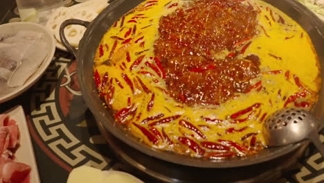 Close-up-Traditional-Chinese-Spicy-Hot-Pot-Style-With-A-Brass-Pot