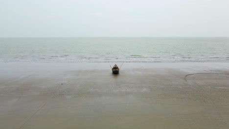 Traditional-Bangladesh-fishing-boat-on-the-beach-Indian-Ocean-aerial-nature-video