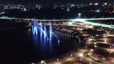 Establishing-Shots-drone-camera-moving-towards-side-where-laser-show-is-going-on-and-fountain-show-is-on