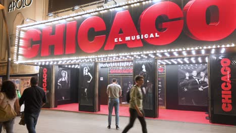 People-are-seen-outside-the-Apolo-Theater,-currently-featuring-and-playing-the-musical-hit-original-Broadway-production-show,-Chicago,-in-Spain