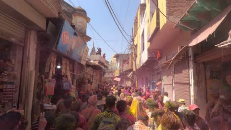 pov-shot-Many-people-are-walking-towards-the-temple-and-are-flying-colors-around-the-side