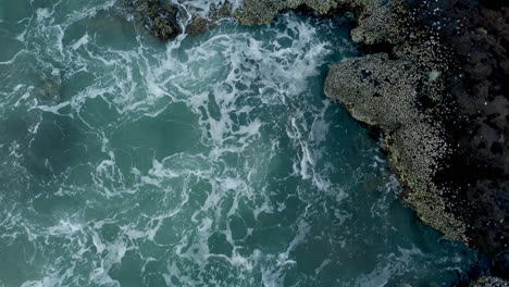 Waves-splashing-on-sea-shore-rocks