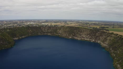 Aerial-drone-view-of-the-blue-lake-Warwar,-Mount-Gambier,-South-Australia