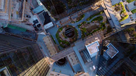 Top-down-drone-shot-rotating-above-the-Mirador-MUT,-sunset-in-Santiago-de-Chile