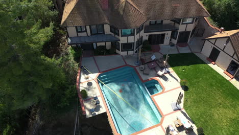 Storm-aftermath,-landslip-at-a-luxury-villa-in-Los-Angeles,-USA---Aerial-view