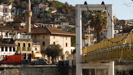 Gorica-Bridge-with-View-of-Ottoman-Houses,-Slowmo,-Berat,-Albania,-Medium-shot