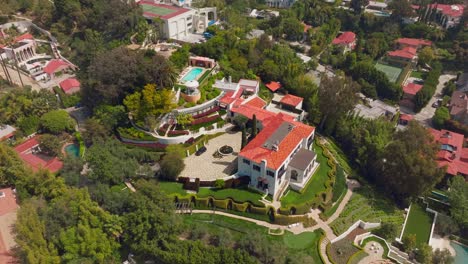 Drone-Over-Stunning-Luxury-Compound-in-Trousdale-Estates,-Beverly-Hills-on-a-Sunny-California-Day