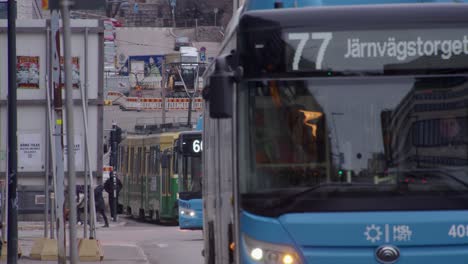 Public-transportation:-Buses-and-tram-cars-on-Helsinki-city-street