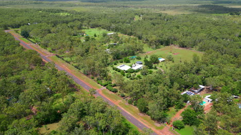 Aerial-Drone-of-Rural-Estate-Large-Block-Hidden-off-Highway-Road-and-Long-Curved-Driveway-into-Forest