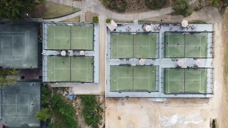 Aerial-top-view-of-a-paddle-tennis-court-on-a-sunny-day,-shot-from-a-dji-4k-drone