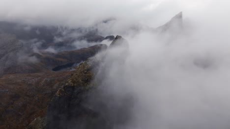 Aerial-view-of-Segla-mountain-above-the-sky,-Norway-during-summer