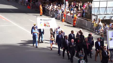 Representatives-from-the-85-and-86-Transport-Platoon-Vietnam-walking-down-the-street,-participating-in-Anzac-Day-parade