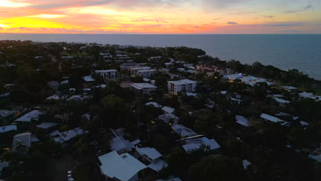 Aerial-Drone-of-Coastal-Rapid-Creek-Neighborhood-in-Darwin-NT-Australia-at-Golden-Hour-with-Red-Glow-from-Sunset-at-Dusk