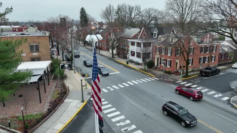 Cyclist-and-Cars-on-road-in-american-town