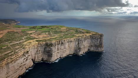 Aerial-view-of-Nature-Scenery-of-Malta's-Dingli-Cliffs-on-a-cloudy-day,-Malta