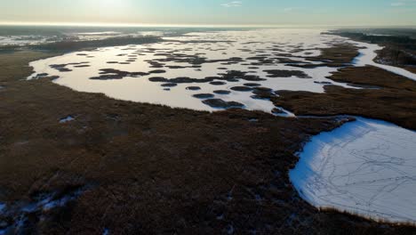 Aerial-view-of-a-frozen-lake-in-a-winter-wonderland