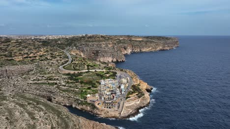 Aerial-Shot-Of-Blue-Grotto-Village-and-Malta's-coastline,-Malta