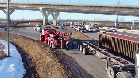 Rescue-services-during-recovery-work-on-a-container-truck-that-tipped-over-on-its-side