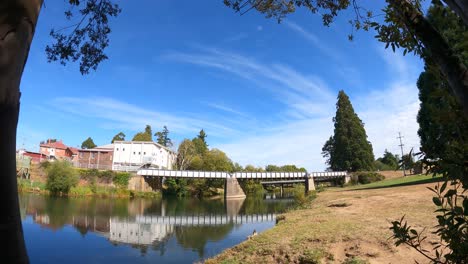 Time-lapse-shot-of-people-walking-along-Meander-River-in-Deloraine-Town-at-sunny-day