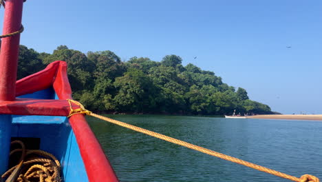 Bow-of-a-wooden-boat-on-calm-water-Rajbagh-Beach-Goa-India-4K