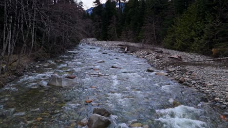 Relaxing-slow-forward-shot-above-flowing-Hansen-Creek-river-in-Snoqualmie,-Washington-State