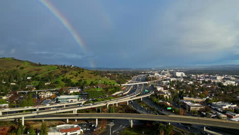 Highway-junction-of-Walnut-Creek-in-California,-aerial-drone-view-with-rainbow