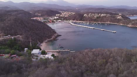 Santa-Cruz-Bay-in-Oaxaca-Mexico,-view-from-perspective-of-a-drone,-Huatulco-Oaxaca-Mexico