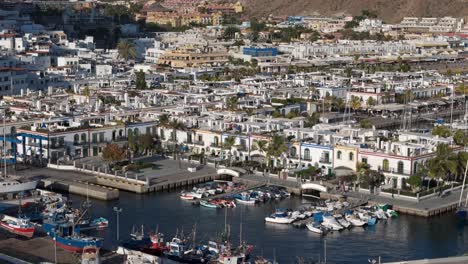 Aerial-city-and-the-port-in-Puerto-de-Mogán,-Lomo-Quiebre,-Las-Palmas-Province,-Spain