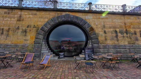 Naplavka-Waterfront-Cafe-Along-The-Vltava-River-In-Prague,-Czech-Republic