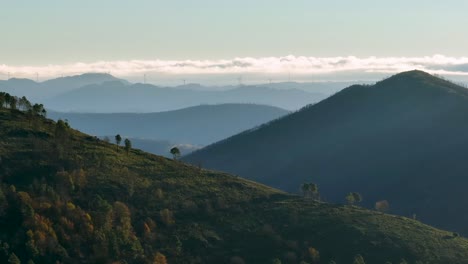 Mountain-silhouettes-and-wind-turbines-on-ridges,-Serra-da-Estrela