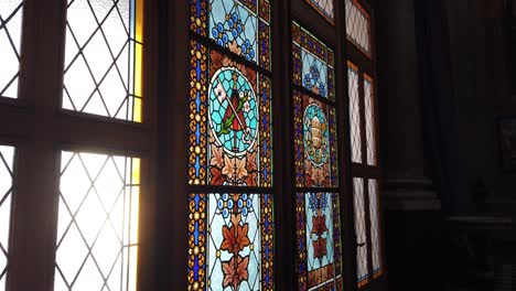 Inside-colorful-glass-art-Stained-glass-vitral-argentina-catholic-basilica-san-jose-de-flores-architecture-with-sun-shining-outside,-religious-hopeful-environment-at-buenos-aires-city