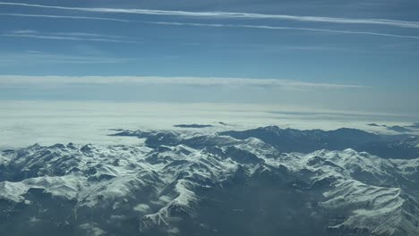 Aerial-view-of-snowed-Pyrenees-mountains-with-fog-at-the-back