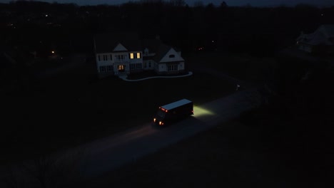 Delivery-truck-in-front-of-mansion-in-USA-at-night