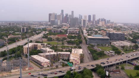 Drone-shot-moving-towards-from-Downtown-Houston,-Texas-and-59-South-freeway