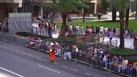 People-gather-in-downtown-Brisbane-city,-filled-with-anticipation-before-the-commencement-of-the-annual-tradition-Anzac-Day-parade-at-Anzac-Square
