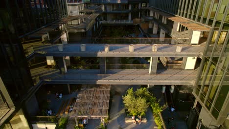 Aerial-view-backwards-through-the-Mirador-MUT,-golden-hour-in-Santiago-de-Chile