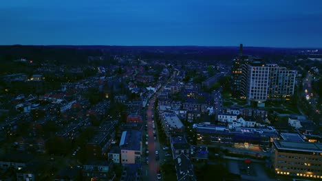 Aerial-night-view-on-Arnhem-traffic-with-cars-and-motors-with-light-Dutch-cityscape