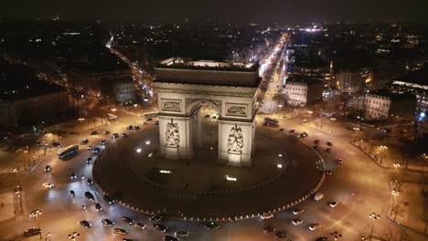 Triumphal-Arch-and-cityscape,-Paris-by-night,-France