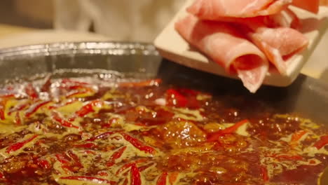 Close-up-Traditional-Chinese-Spicy-Hot-Pot-Style-With-A-Brass-Pot