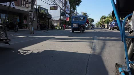 Incredible-Road-Level-View-Captured-from-a-Tuk-Tuk:-Navigating-Through-Dumaguete-Traffic-on-the-Way-to-Downtown,-Negros-Island,-Philippines---A-Unique-Perspective