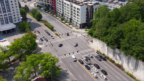 Vehicles-On-Streets-Amidst-Buildings-In-City---Aerial-Drone-Shot