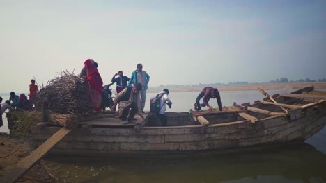 Village-people-travelling-with-wood-in-traditional-large-boats-in-Chambal-River-of-Morena-dholpur-area-of-India